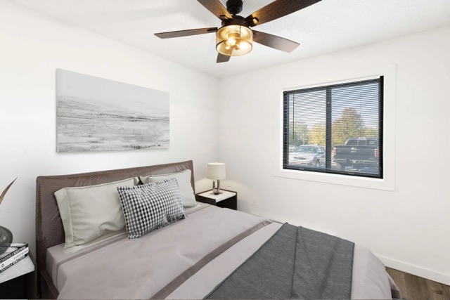 Staged bedroom with ceiling fan in a renovated home at The Cypress